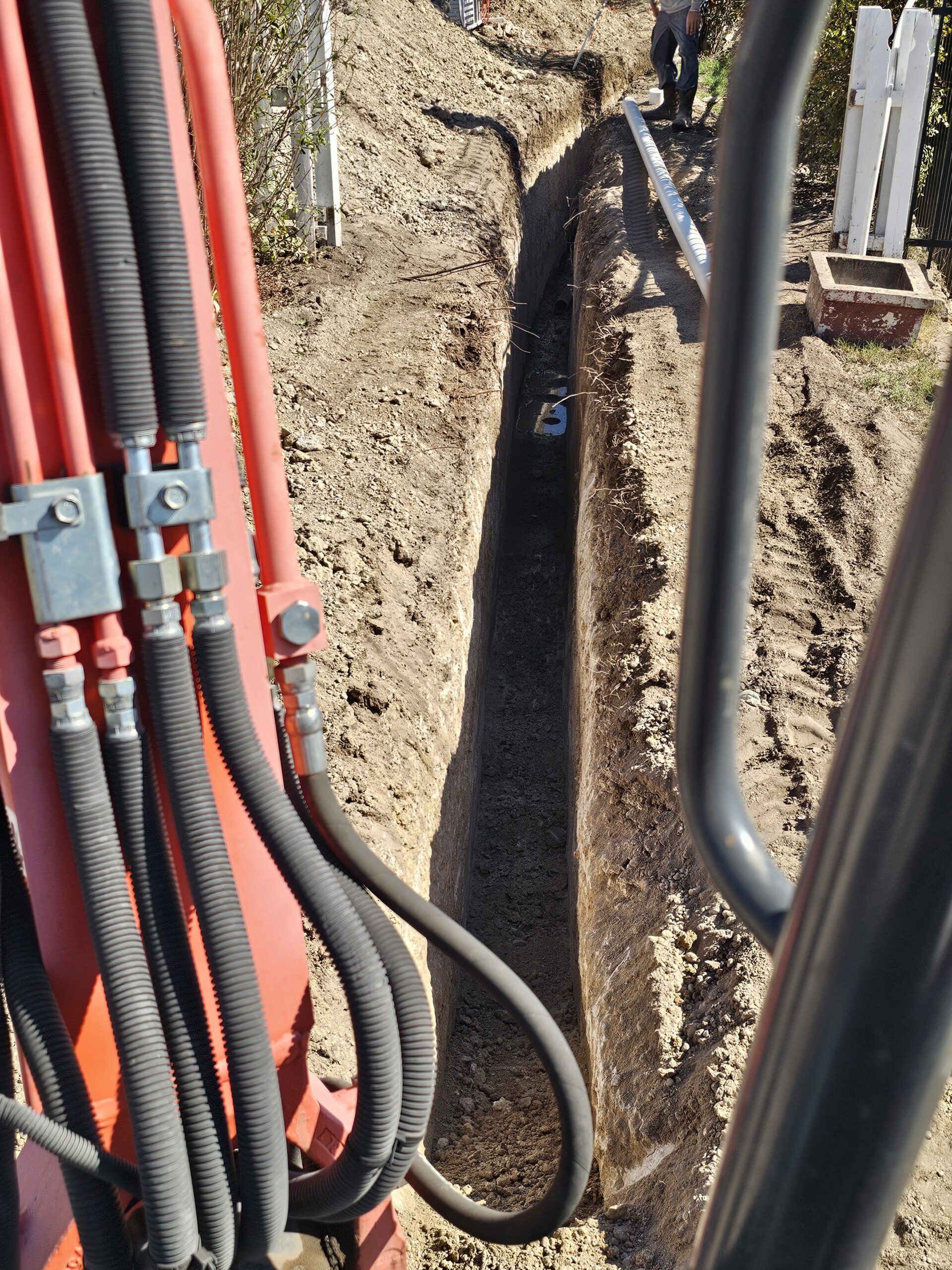 Water line installation project by Prestige Plumbing Weatherford TX showing newly dug trench