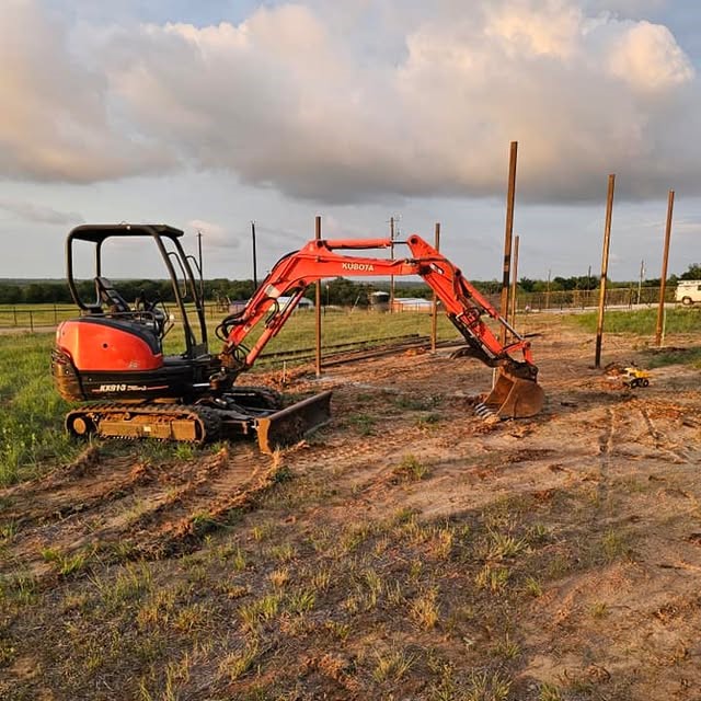 Kubota excavator at a construction site in Weatherford TX preparing ground for plumbing or construction work.